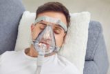 A,Young,Handsome,Man,With,An,Oxygen,Mask,On,His